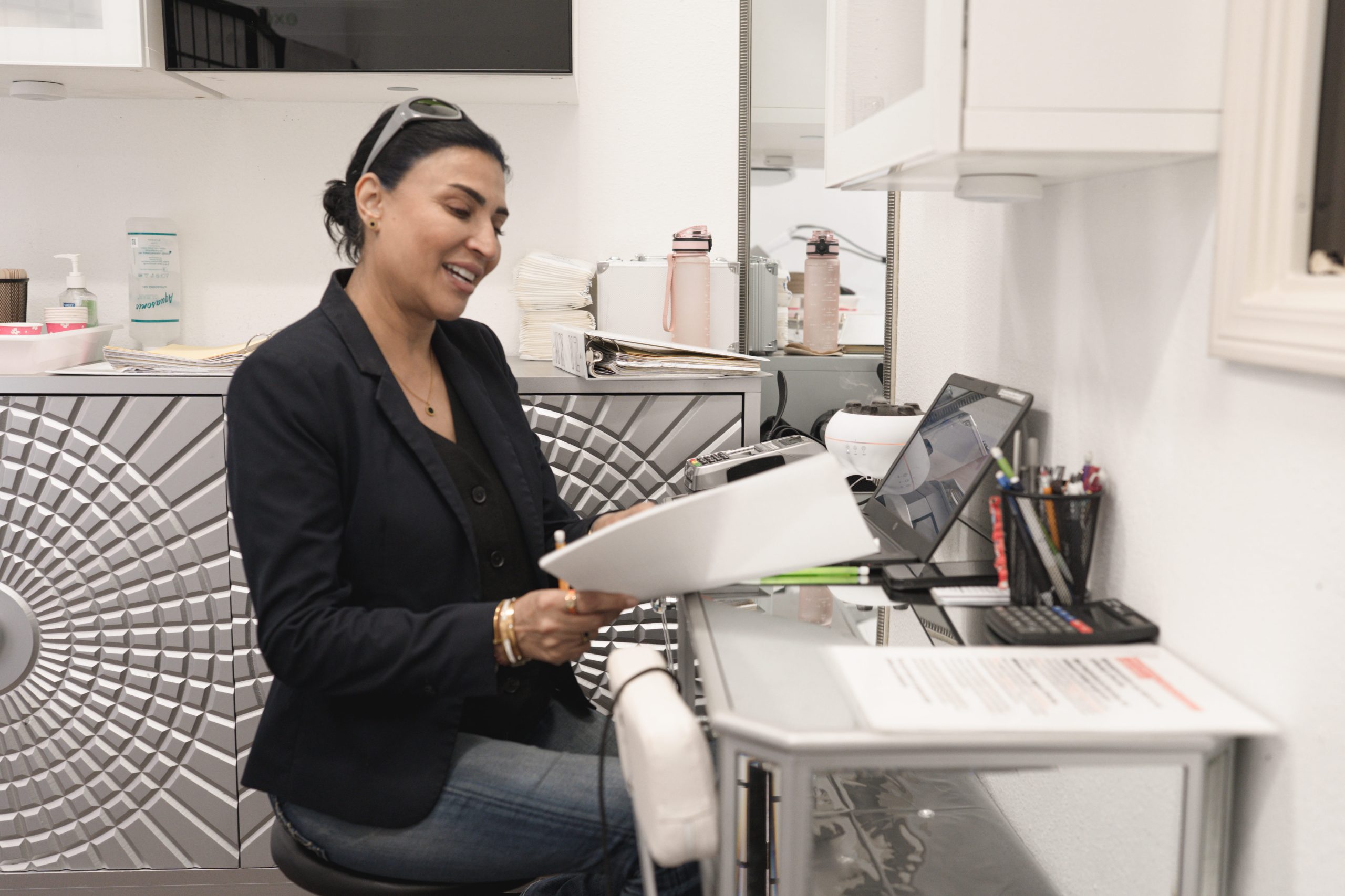 West University-101 salon suite renter doing admin work